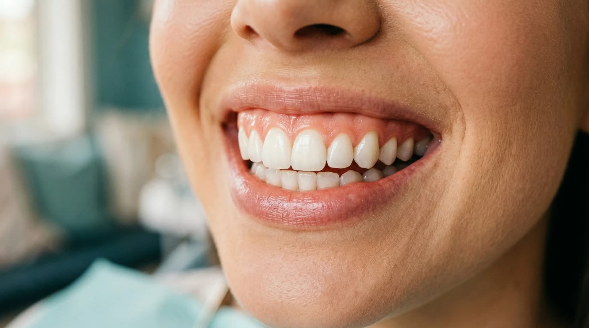 Person experiencing tooth sensitivity while eating ice cream